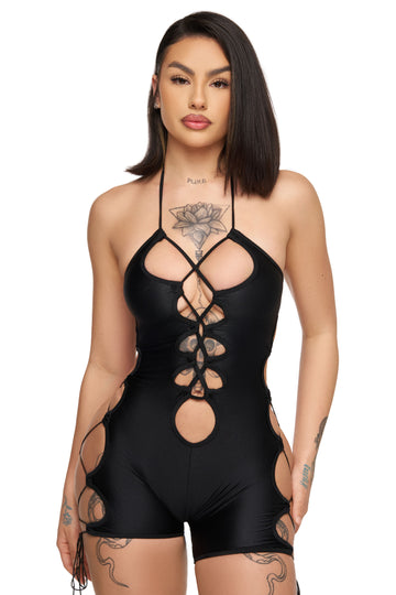 a woman wearing a black bodysuit with cut outs, bottle girl outfits, rave wear